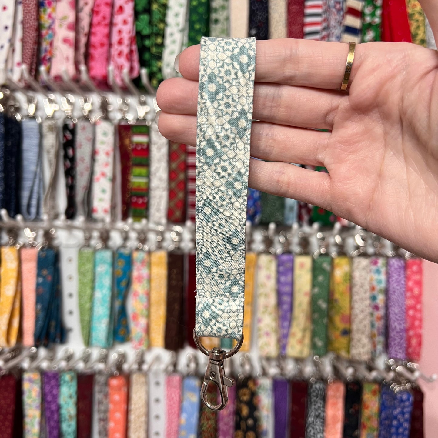 Cream and Teal Geometric Floral Wristlet