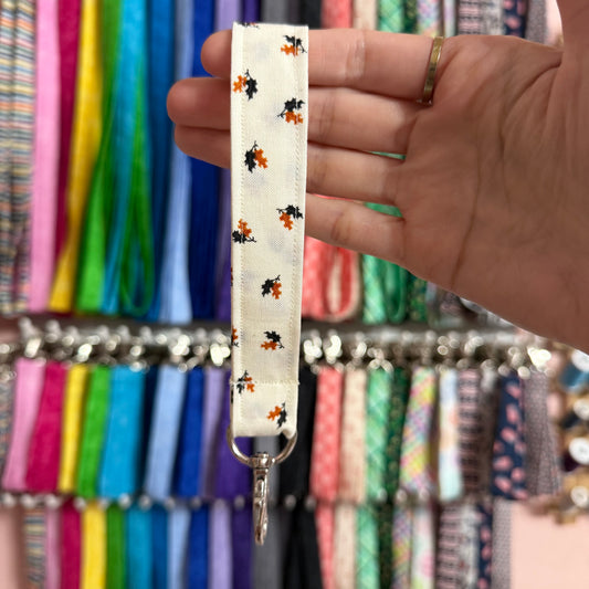 Orange and Black Leaves Wristlet