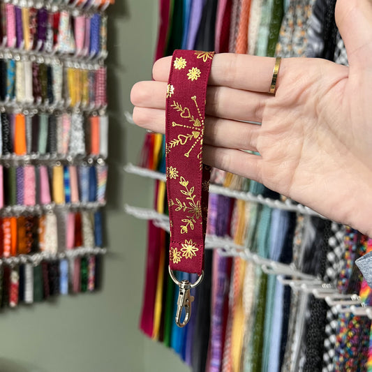 Maroon and Gold Snowflake Wristlet