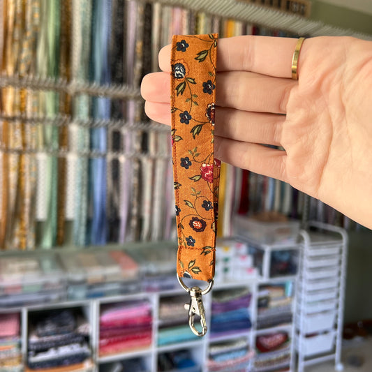 Burnt Orange Floral Wristlet