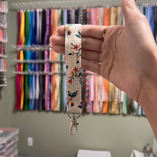 Cream, Blue, and Orange Floral Wristlet