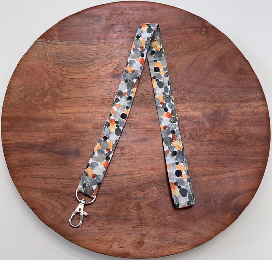 Gray and Orange Pebble Lanyards